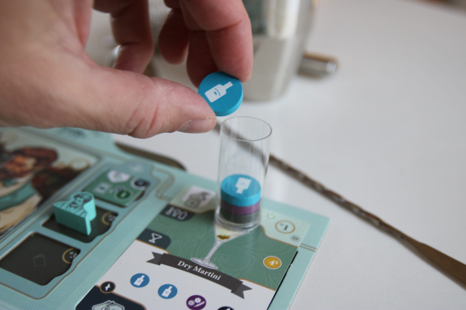 Dropping an ingredient token into the shaker