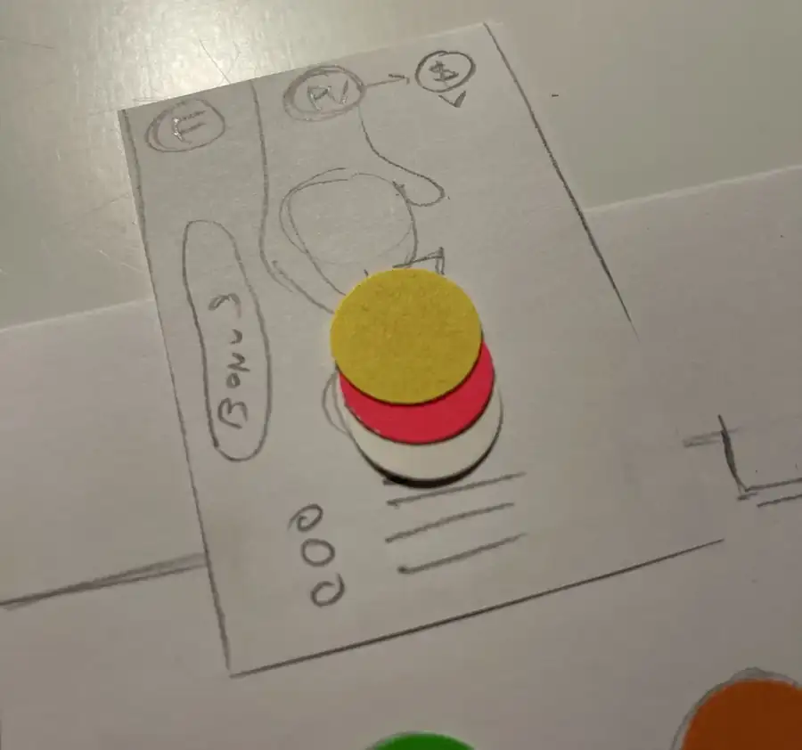 First prototype: a pencil-drawn card and three stacked paper discs